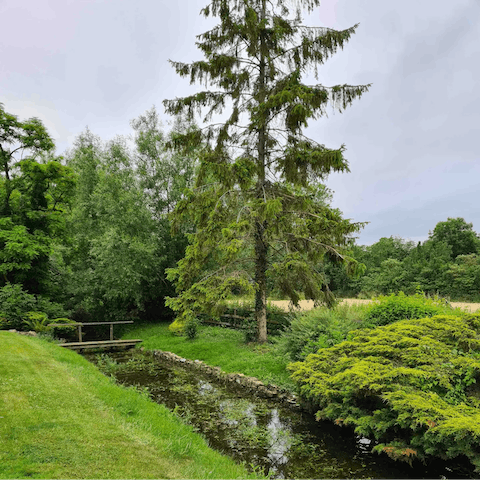 Find tranquility by the River Great Ouse which runs through the home's six acres of grounds