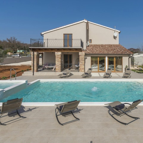 Take a dip in the pool or relax in the sun on a lounger