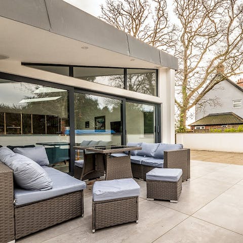 Enjoy a round of drinks and snacks on the patio at sundown