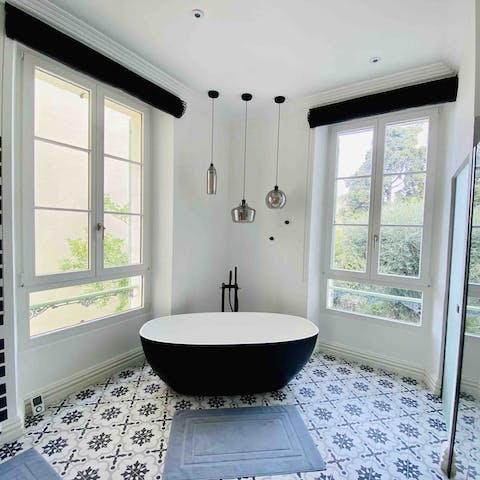 Relax in the freestanding tub after a busy day exploring the coast