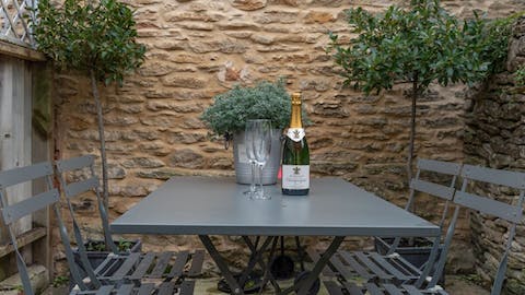 Enjoy a glass of wine outside on the private stone terrace