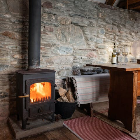Collect driftwood from your private beach and keep the cabin cosy-warm