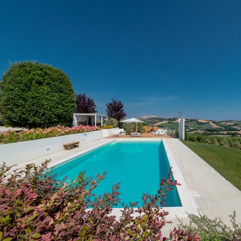 Spend afternoons swimming in the pool and lounging in the sun