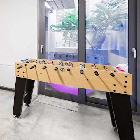 Get competitive over a game of table football, after a day at Kalamaki Beach