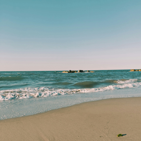Stroll along Santa Maria del Focallo beach, fifteen minutes away