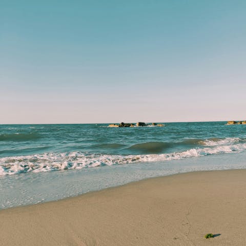 Stroll along Santa Maria del Focallo beach, fifteen minutes away