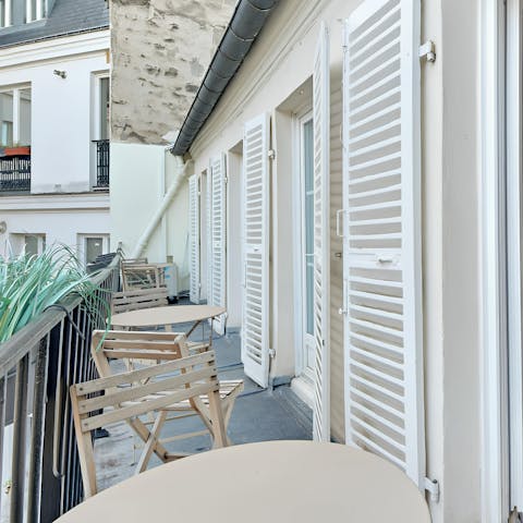 Take in the views over the courtyard from the private balcony