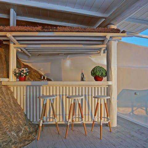 Mix up a batch of sundowners at the poolside bar