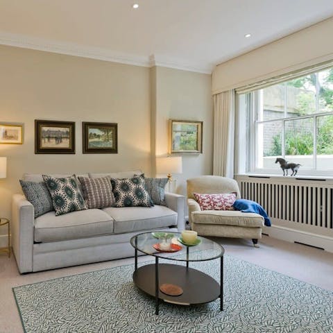 Unwind in the light-filled living space after a day of exploring