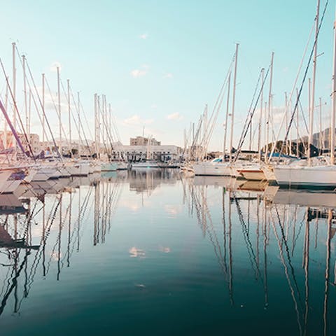 Breathe in the sea air as you stroll around the port of Palermo