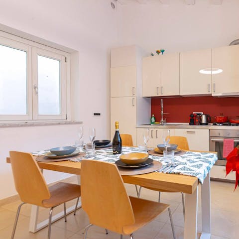 Gather at the kitchen table for pasta and a bottle of wine with loved ones