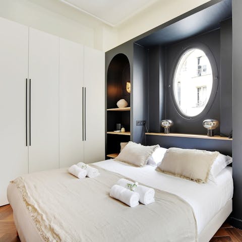 Sink into the plush bed after a day of Parisian sightseeing