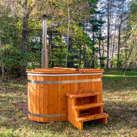Relax and unwind under the stars in the outdoor hot tub
