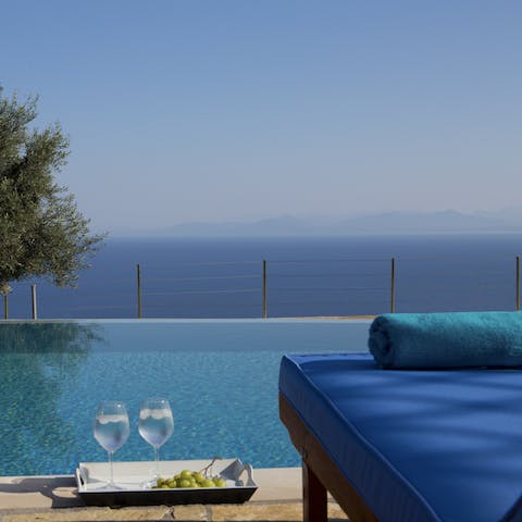 Glide gracefully through the infinity pool and retire to a lounger afterwards