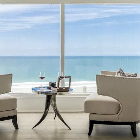 Relax with a glass of wine as you look out across the sea