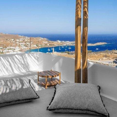 Enjoy morning coffee on the rooftop terrace overlooking the bay