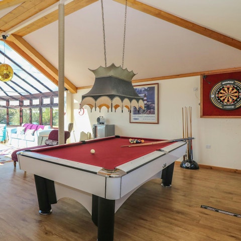 Play a game of pool or darts after a walk on the local sands