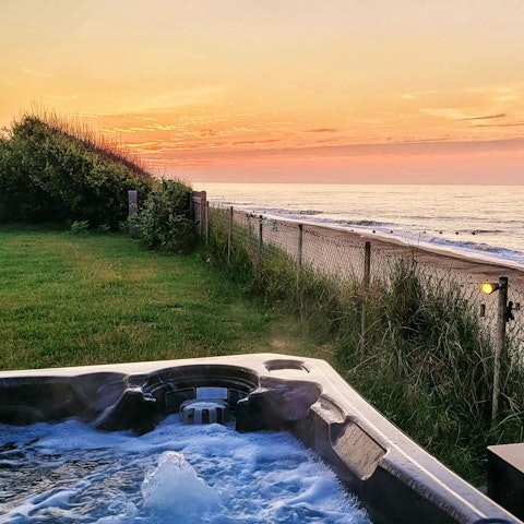 Watch the sunset over the North Sea from the hot tub