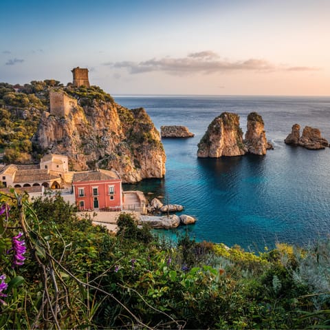 Make the twenty-minute walk to the pretty coastal village of Scopello