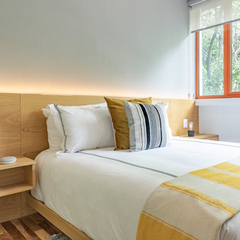 Wake up to the birds singing in the trees outside the window