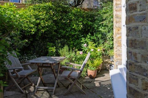 Bask in the summer sunshine with a cuppa in the quaint garden