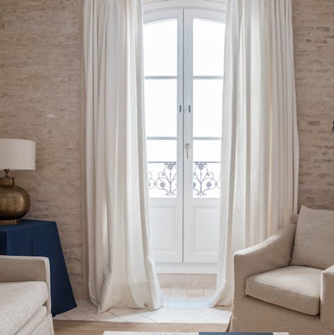 Relax with a good book in the living room, filled with sunlight