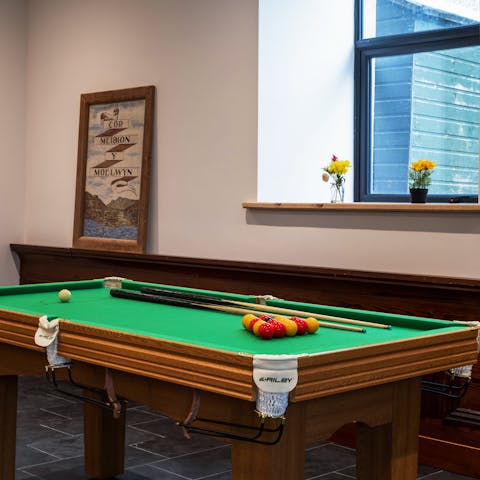 Play a few rounds of pool with the family in the evening