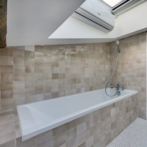 Soak travel weary legs in the en-suite bathroom