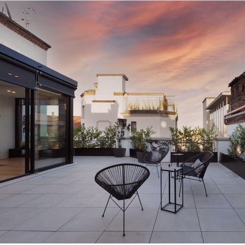 Sip limoncello on the private terrace as the sky dances with colour