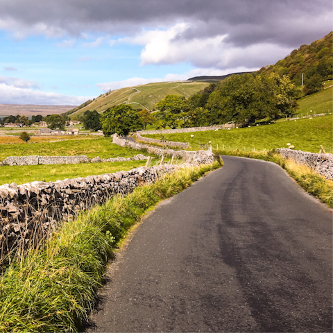 Stretch your legs at the Yorkshire Dales National Park, a twenty-six-minute drive away