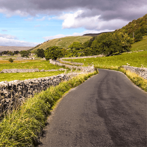 Stretch your legs at the Yorkshire Dales National Park, a twenty-six-minute drive away