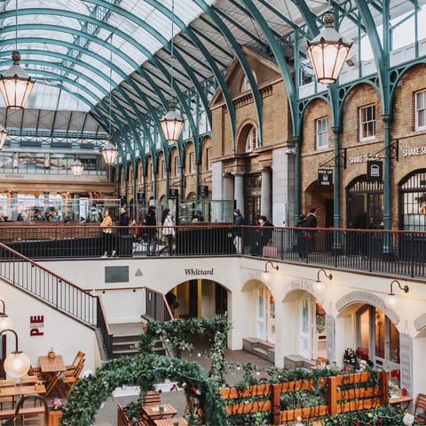 Admire the market stalls and boutique shops in nearby Covent Garden