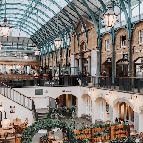 Admire the market stalls and boutique shops in nearby Covent Garden