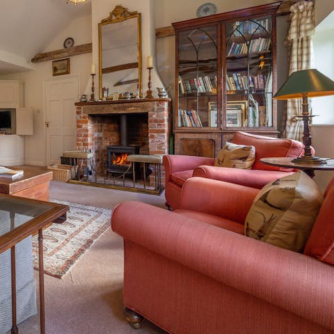 Cosy up with a book in front of the wood-burning fire