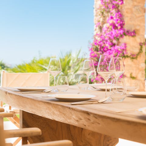 Raise a glass of wine while dining on the terrace