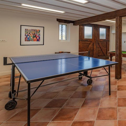 Get competitive over a game of ping pong in the games room