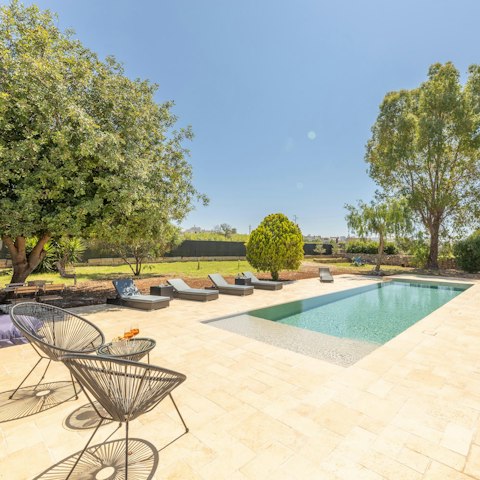 Relax by the pool on a sun lounger after having a dip