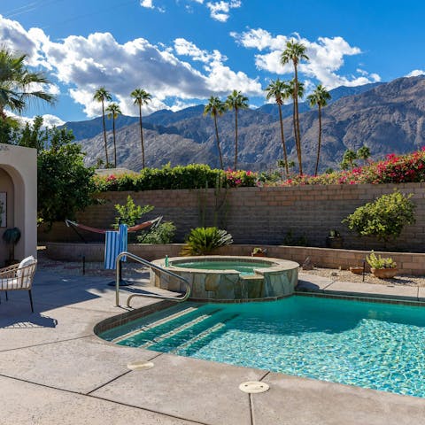 Relax in the private pool and hot tub with its views of palms and mountains