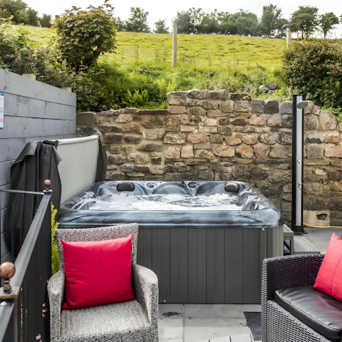 Enjoy a luxurious soak in the private hot tub