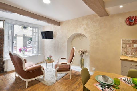 Watch the world go by from this window that opens out to the quietly bustling street