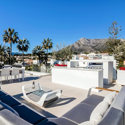 Head up to the roof terrace for sunsets overlooking the mountains