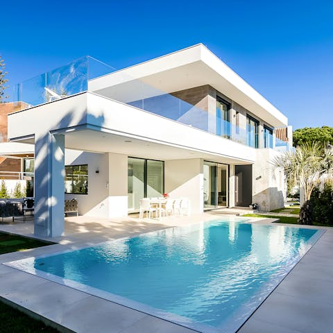 Spend lazy days relaxing by the heated private pool