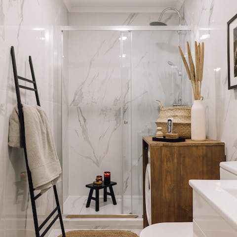 Pamper yourself in the swish bathroom with its rainfall shower