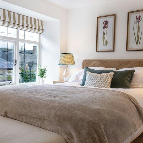 Retire to the master bedrooom where a snuggly king-size bed awaits