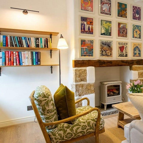 Pick a book from the shelf to get absorbed in by the fire