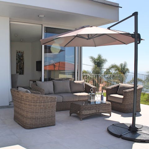 Sip cocktails as the sun sets over the glistening seascape from the terrace lounge