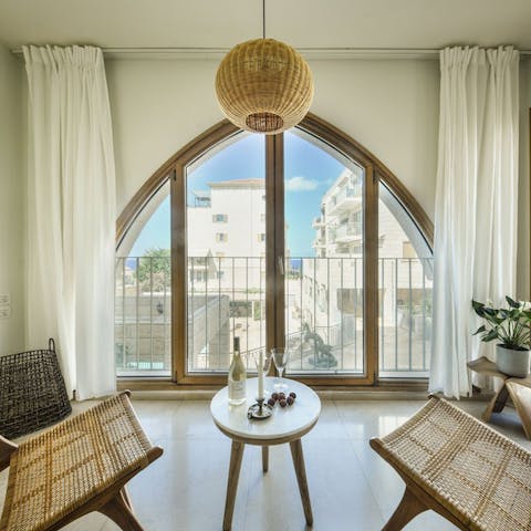 Look out at the beautiful city landscape through the striking windows throughout the home that bathe the space in natural sunlight
