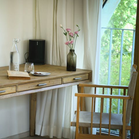 Set yourself up for some remote work at one of the desks, with beautiful natural views through the large windows