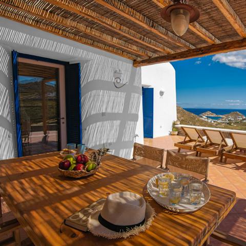 Gather everyone together for dinner fresh off the grill under the verandah