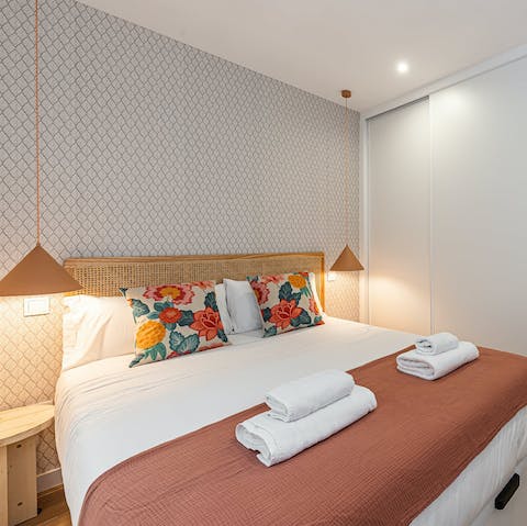 Get some rest in the comfy bed after a busy day in Madrid